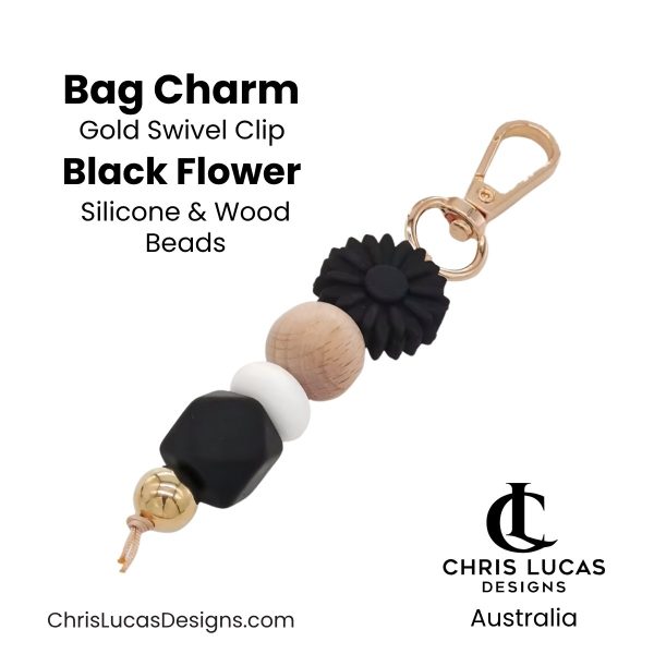 Black flower bag charm with gold swivel clip and silicone and wood beads for handbags and key rings