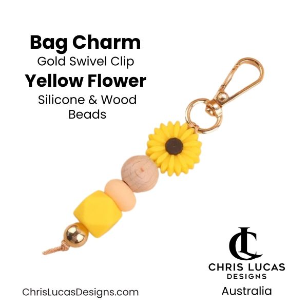 Yellow flower bag charm with gold swivel clip and silicone and wood beads for handbags and key rings